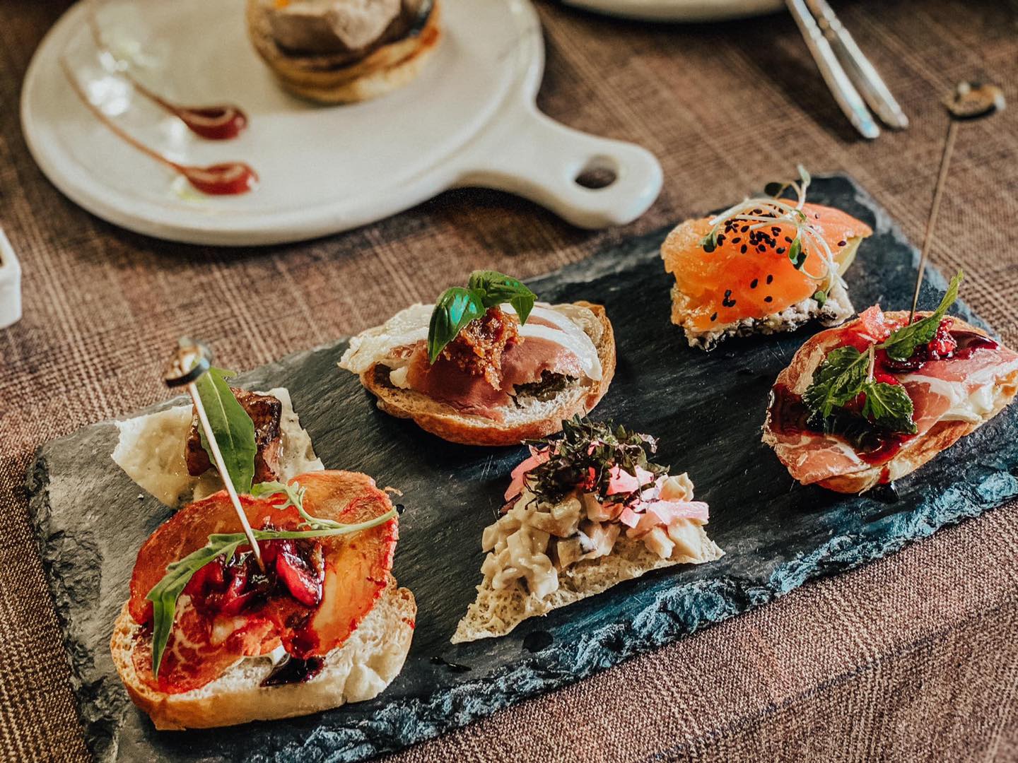 Enjoy authentic European dishes in the romantic space of Pincho Tapas Kitchen & Drinks 18