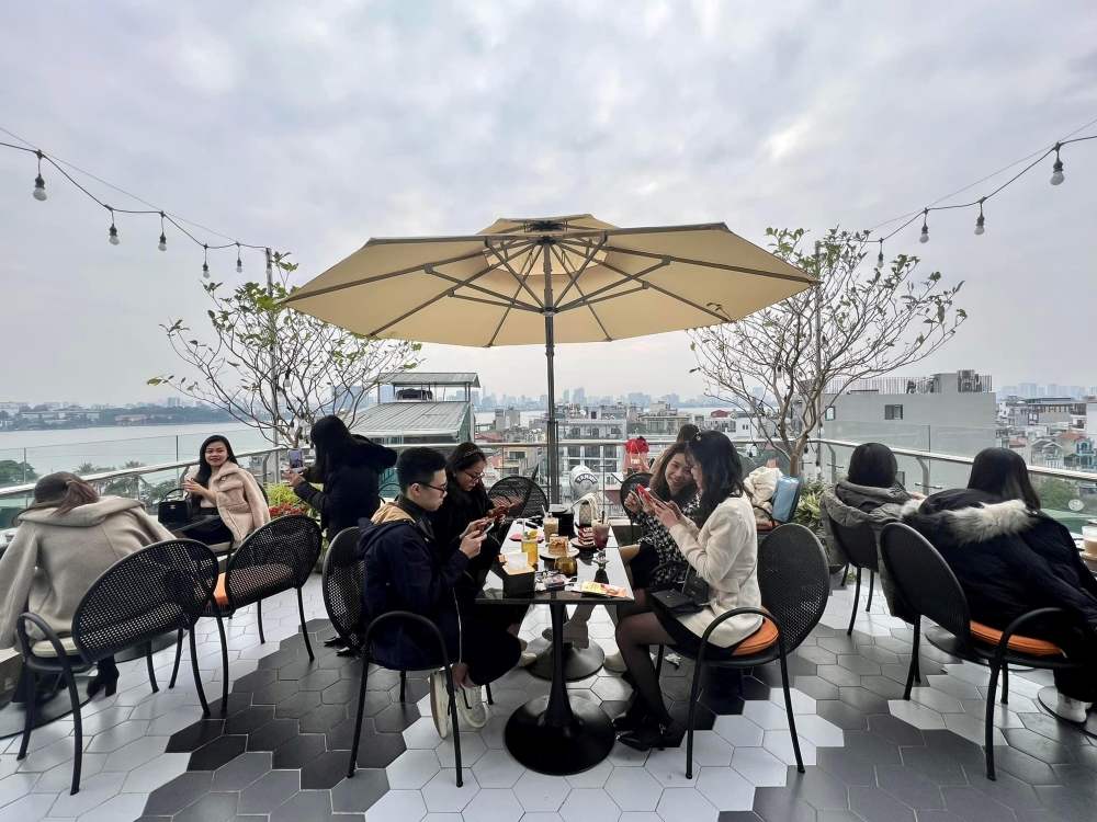 Watch the sunset across West Lake at Laguna Rooftop Hanoi 7