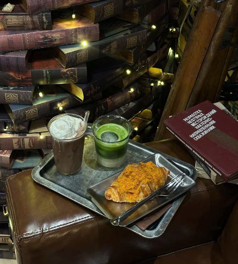 Enjoy a Cafe, explore the cafe with a giant wall of books 11